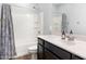 Bathroom featuring a shower-tub combination and vanity with white countertops at 19664 W Woodlands Ave, Buckeye, AZ 85326