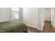 Inviting bedroom features a window, closet and wood floors at 19664 W Woodlands Ave, Buckeye, AZ 85326