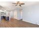 Open living space with kitchen island and view of entry and hallway at 19664 W Woodlands Ave, Buckeye, AZ 85326