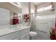 Clean and bright bathroom with a bathtub shower and framed art at 19722 N Regents Park Dr, Surprise, AZ 85387