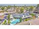 Inviting single-story home featuring a private pool, covered patio, and lush desert landscaping at 2046 E Downing St, Mesa, AZ 85213