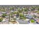 Wide aerial shot showcasing a neighborhood with mature trees and well-maintained homes at 2046 E Downing St, Mesa, AZ 85213