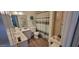 Cozy bathroom with a striped shower curtain, tiled floors, and stylish decorative accents at 2046 E Downing St, Mesa, AZ 85213