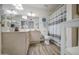 Well-lit bathroom featuring a single sink vanity, toilet, and shower with a curtain at 2046 E Downing St, Mesa, AZ 85213