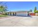 Well-maintained single-story home with a large front yard and driveway at 2046 E Downing St, Mesa, AZ 85213