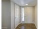 Bright foyer with wood-look tile flooring and neutral walls leading to the main living areas at 2046 E Downing St, Mesa, AZ 85213