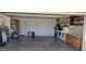 Spacious garage featuring built-in shelving and cabinets, perfect for storage and organization at 2046 E Downing St, Mesa, AZ 85213