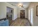 Cozy bonus room with a vintage piano and wood-look tile floors, offers a quiet retreat inside the home at 2046 E Downing St, Mesa, AZ 85213