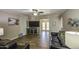 Inviting living room featuring wood-look tile floors, comfortable furniture, and a view to another room at 2046 E Downing St, Mesa, AZ 85213