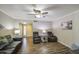 Cozy living room featuring wood-look tile flooring, comfortable seating and contemporary decor for relaxed living at 2046 E Downing St, Mesa, AZ 85213