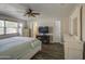 Spacious main bedroom featuring a ceiling fan, TV, and ensuite bathroom at 2046 E Downing St, Mesa, AZ 85213