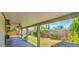 Covered patio offers an outdoor living space with a view of the landscaped backyard at 2046 E Downing St, Mesa, AZ 85213