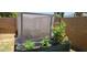 Backyard showcasing a raised garden bed for growing fresh produce and plants at 2046 E Downing St, Mesa, AZ 85213