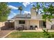 Well-maintained backyard with covered patio, lounge chairs, and green lawn, perfect for relaxation at 2418 E Hermosa Dr, Tempe, AZ 85282