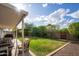 Serene backyard with covered patio, cozy seating, and well-maintained lawn for relaxing outdoor enjoyment at 2418 E Hermosa Dr, Tempe, AZ 85282