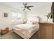 Cozy bedroom featuring a ceiling fan, and a large window that provides lots of natural light at 2418 E Hermosa Dr, Tempe, AZ 85282