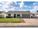 Well-maintained single-Gathering home featuring a lush green lawn and spacious two-car garage at 2418 E Hermosa Dr, Tempe, AZ 85282