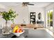 Modern kitchen with a view to a dining area, highlighting a bowl of fruit and elegant dining set at 2418 E Hermosa Dr, Tempe, AZ 85282