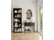 Stylish living area with a bookshelf, a table with liquor, and a mirror at 2418 E Hermosa Dr, Tempe, AZ 85282