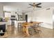 Open floor plan showcases a modern kitchen and dining area with a large wooden table and stylish chairs at 2418 E Hermosa Dr, Tempe, AZ 85282