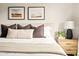 Close up of a beautifully staged bed in the main bedroom with soft neutral decor at 2418 E Hermosa Dr, Tempe, AZ 85282