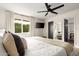 Spacious main bedroom featuring an ensuite, a ceiling fan and lots of natural light at 2418 E Hermosa Dr, Tempe, AZ 85282