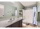 Bathroom with tub shower and single sink vanity at 24229 W Tonto St, Buckeye, AZ 85326