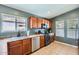 Kitchen featuring stainless steel appliances, tile floors, and wood cabinets at 24229 W Tonto St, Buckeye, AZ 85326