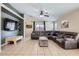 Spacious living room with tile flooring, comfortable seating, and vaulted ceiling at 24229 W Tonto St, Buckeye, AZ 85326