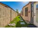 Charming backyard with artificial turf, stepping stones, and a block wall for privacy at 24648 N 40Th Ln, Glendale, AZ 85310