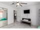 Bedroom with a sliding door and a bench in front of a closet at 24648 N 40Th Ln, Glendale, AZ 85310