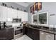 Close up of the modern kitchen featuring stainless steel appliances and decorative backsplash at 24648 N 40Th Ln, Glendale, AZ 85310