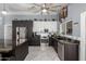Gourmet kitchen with stainless steel appliances, granite countertops, and ample cabinet space at 24648 N 40Th Ln, Glendale, AZ 85310