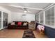 Cozy sun room with comfortable sofa and ceiling fan at 24648 N 40Th Ln, Glendale, AZ 85310