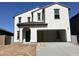 Charming two-story home with a stucco exterior, an attached two-car garage, and a brown tiled roof at 29789 N Oak Dr, Florence, AZ 85132