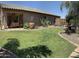 Expansive backyard with desert landscaping, a covered patio, and ample space for outdoor enjoyment at 30178 N Coral Bean Dr, San Tan Valley, AZ 85143