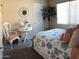 Bedroom featuring coastal decor with a large window and white chair at 30178 N Coral Bean Dr, San Tan Valley, AZ 85143