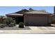 Charming single-Gathering home with a well-maintained front yard, desert landscaping, and a two-car garage at 30178 N Coral Bean Dr, San Tan Valley, AZ 85143
