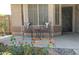 Cozy front porch with seating, decorative rug, and desert landscaping, offering a warm welcome at 30178 N Coral Bean Dr, San Tan Valley, AZ 85143
