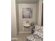 Charming interior nook featuring decorative table, patterned chair, and floral artwork at 30178 N Coral Bean Dr, San Tan Valley, AZ 85143