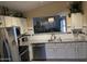 Bright kitchen features stainless steel appliances, white cabinets, granite countertops, and tiled backsplash at 30178 N Coral Bean Dr, San Tan Valley, AZ 85143