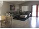 Open concept living room with tile flooring, two couches, and an ottoman at 30178 N Coral Bean Dr, San Tan Valley, AZ 85143