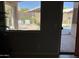 View from inside the house to the pool with white patio furniture outside the door at 30178 N Coral Bean Dr, San Tan Valley, AZ 85143