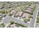 Expansive aerial shot showcasing well-maintained homes with desert landscaping in a peaceful neighborhood at 30374 N 124Th Dr, Peoria, AZ 85383