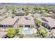 Serene aerial perspective of a home with an inviting pool, mini golf, and lush landscaping at 30374 N 124Th Dr, Peoria, AZ 85383