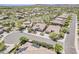 Wide aerial view showcasing houses with desert landscaping in a well-maintained, peaceful neighborhood at 30374 N 124Th Dr, Peoria, AZ 85383