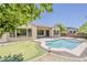 Beautiful backyard with a refreshing pool, putting green, and lovely landscaping at 30374 N 124Th Dr, Peoria, AZ 85383