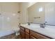 Bright bathroom features a dual sink vanity, ample counter space, and a shower-tub combo at 30374 N 124Th Dr, Peoria, AZ 85383