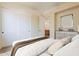 Neutral bedroom with a large bed, closet, and view of the ensuite at 30374 N 124Th Dr, Peoria, AZ 85383