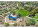 Aerial view of community park featuring playground, shade canopies, and open green space at 30374 N 124Th Dr, Peoria, AZ 85383